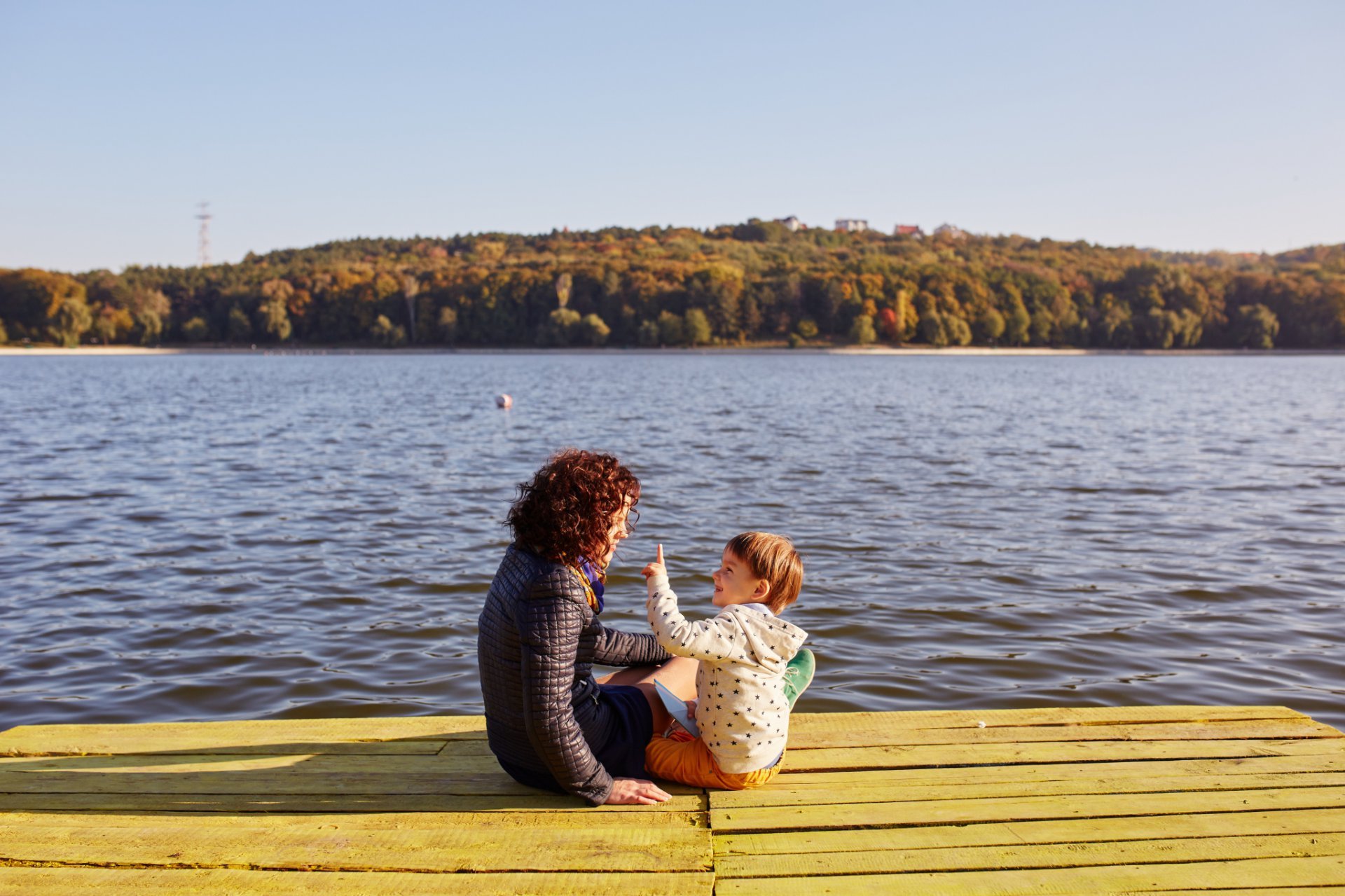 Mom Son Resting By Lake