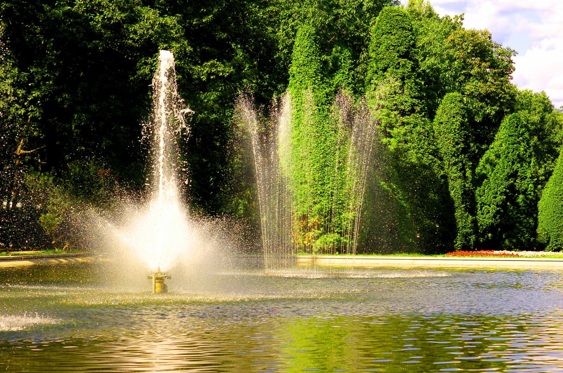 Nice Fountain With Leafy Trees Background